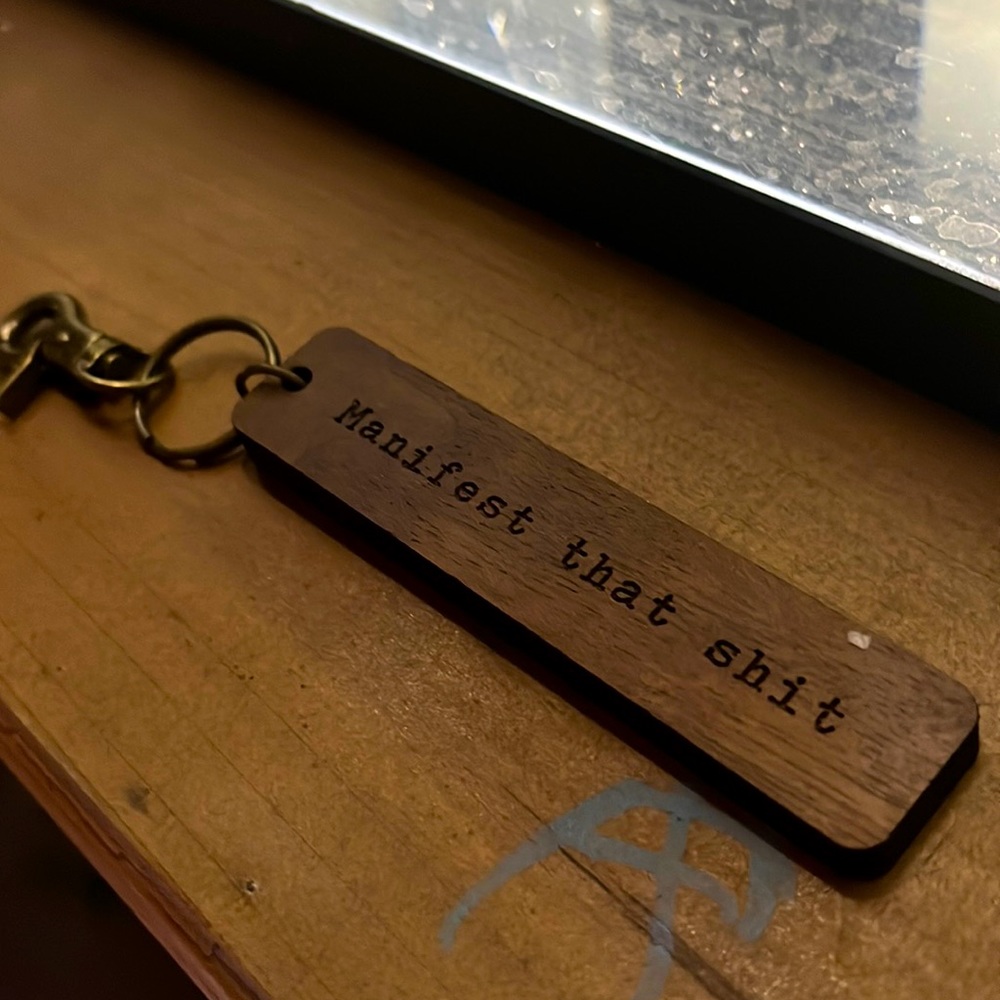 Hand crafted keychains “manifest that shit”